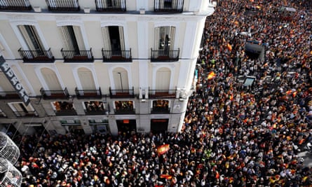 An aerial view of a huge crowd of protesters packed into a square in central Madrid