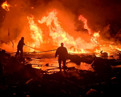 Civil defence forces attempt to extinguish a blaze that erupted after an Israeli bombardment on a solar farm and electricity generation facility in Tyre, 4 March.