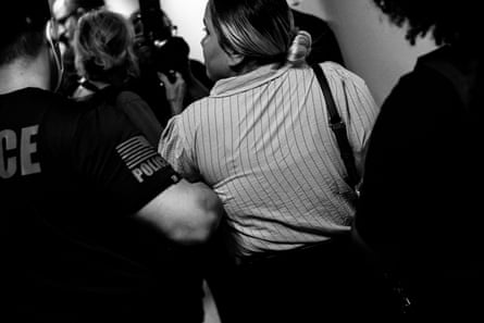 A man pulls a woman to a stairwell