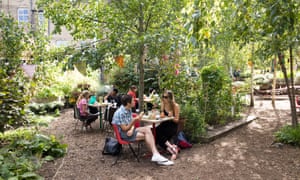 Cafe tables at Dalston Eastern Curve Garden, Hackney,
