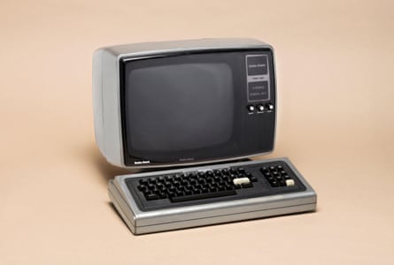A very retro PC made by Tandy, on a beige background.