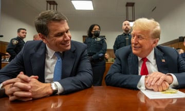 Trump and Todd Blanche smile at each other in court