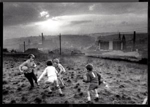Boys playing football in Oldham, 1982
