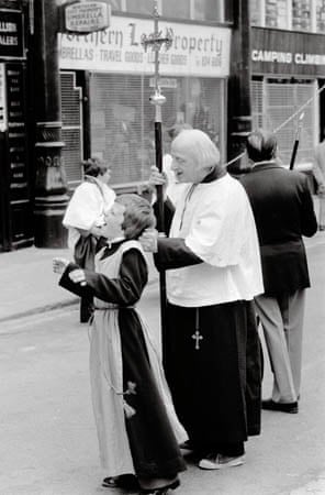 Anglican Whitsuntide walk, Manchester, 1980, a church man puls a chiorboy's hair