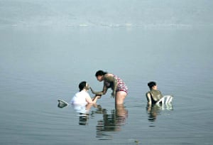 Israel: Bathers apply mineral mud in the Dead Sea