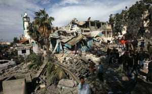 Palestinians inspect a destroyed Hamas police station following an Israeli air strike in Gaza City on December 27, 2008. Israel launched a massive wave of air strikes on Hamas targets in Gaza today, killing at least 140 Palestinians after warning of a fiery riposte to ongoing rocket fire, officials said.