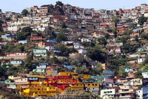 Caracas, Venezuela: The facades of a poor neighbourhood painted as advertising billboards
