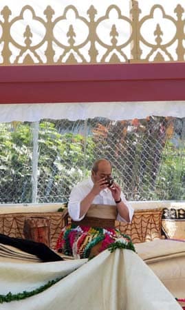 UnassignedKing George Tupou V of Tonga drinks a coconut shell of kava