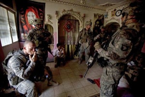 American troops search a house in Baghdad