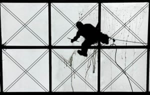Dresden, Germany: A cleaner wipes the glass roof of the shopping mall