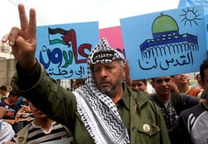 A man dressed as Yasser Arafat