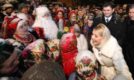 Prime Minister Yulia Tymoshenko greets people during the Orthodox Christmas celebrations