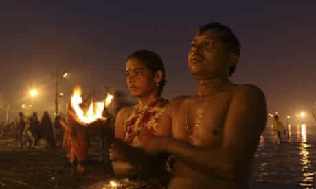 Hindu devotees offer prayers during the Makar Sankranti festival in Allahabad, India