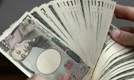 A bank teller counts 10,000 yen.