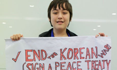 Activist Jonathan Lee holds a banner