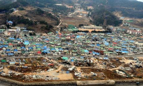 aeriel image of damaged houses on yeonpyeong island  