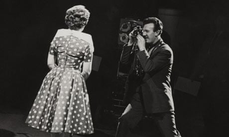 Bill Francis takes a picture of singer Marion Ryan