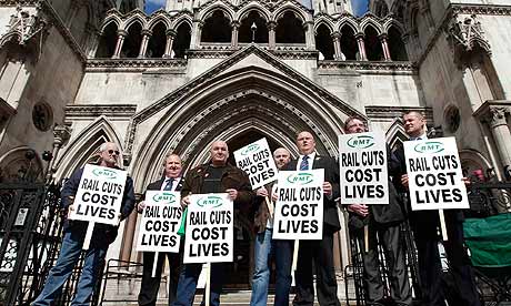 Rail Maritime and Transport (RMT) union supporters protest in front of the high court