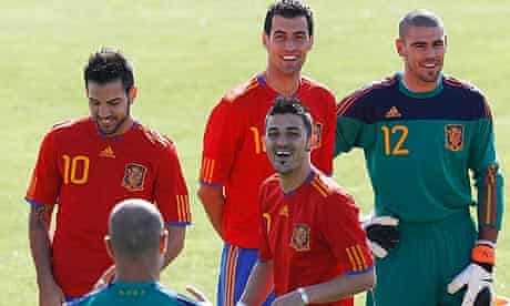 Spain's national soccer team players joke before posing for an official portrait in Las Rozas