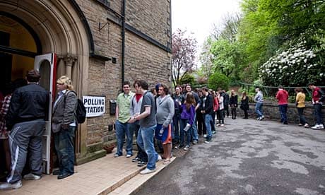 Voters queue outside a polling station in the Sheffield Hallam constituency.