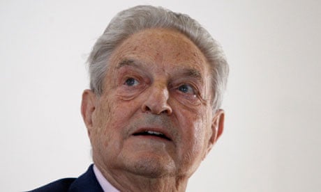 Soros waits to deliver his speech in Berlin earlier today.