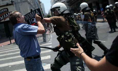 Greek police clash with a protesters earlier today.