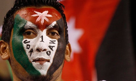 The painted face of a Jordanian fan