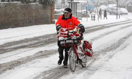 Postman and bike in snow