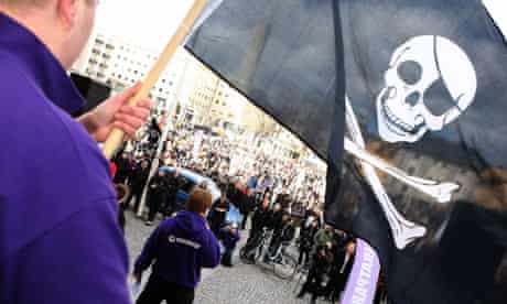 Supporter of The Pirate Bay, waves a flag 