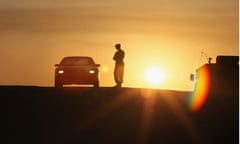 A police officer stops a car in the deep south