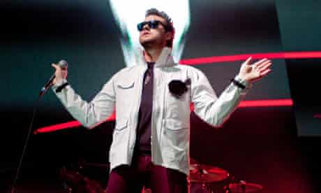 Kasabian frontman Tom Meighan onstage at the O2 Arena in London.
