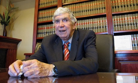 Luis Posada Carriles sitting at a table
