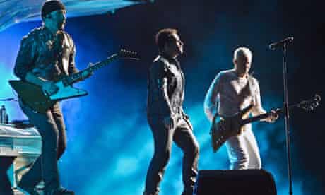 u2's Bono, the Ddge and bassist Adam Clayton on stage