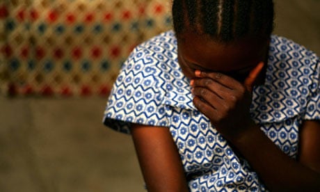 Congo rape victim shields her face