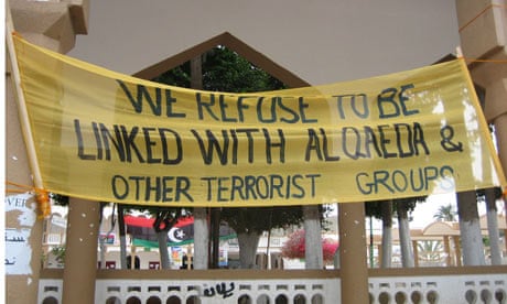 Derna banner reading 'we refuse to be linked with al-qaeda'