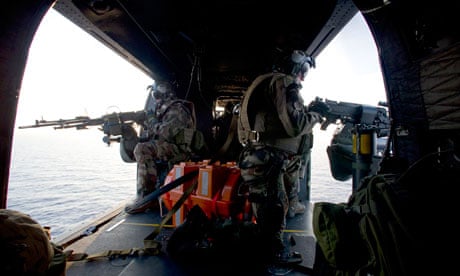 Door gunners aboard a French military attack helicopter