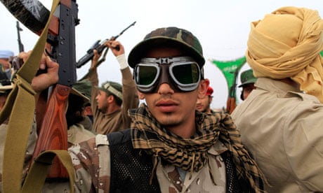 A Libyan government soldier poses for the camera 
