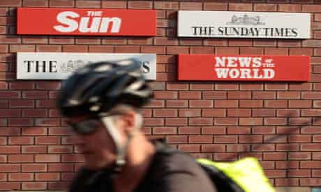 A cyclist passes the News International headquarters in Wapping, east London