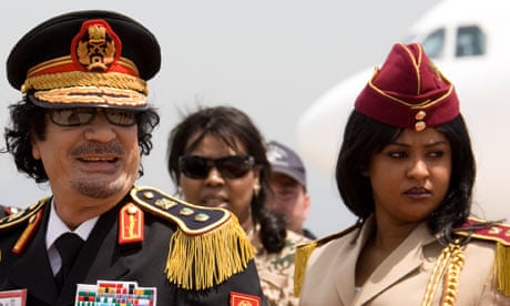 Gaddafi with a female guard