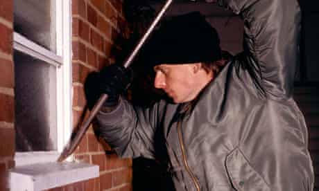 burglar breaking into a house