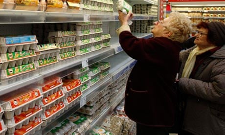 Women buy eggs in a supermarket