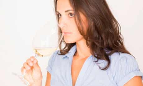 young woman tasting white wine 