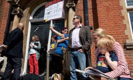 demonstrators protest the closure of Mark Twain Library in Brent, London. 