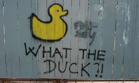 Spray paint image on a duck and slogan