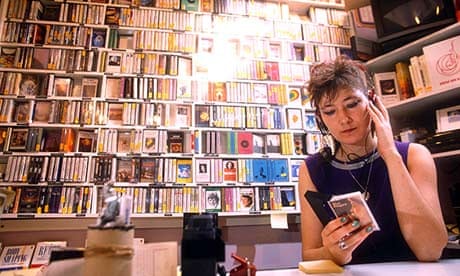 A woman listening to a cassette in the 80s