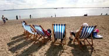 People sit in deckchairs on the beach at Southend, Essex. It is (allegedly) the new cool place to live. 