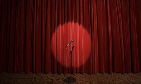 Spotlight on microphone stand on stage 