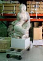 Artworks and a statue in storage