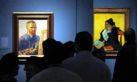 Visitors stand in front of a self-portrait by Van Gogh at the Royal Academy