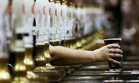 Pint and row of beer pumps 